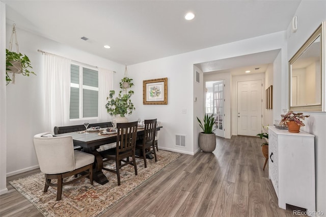 dining room with wood-type flooring