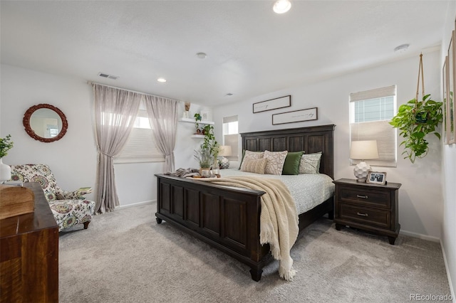 bedroom featuring light carpet