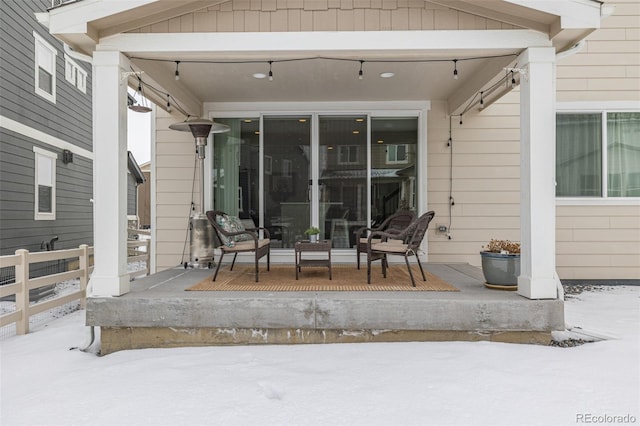 view of snow covered patio