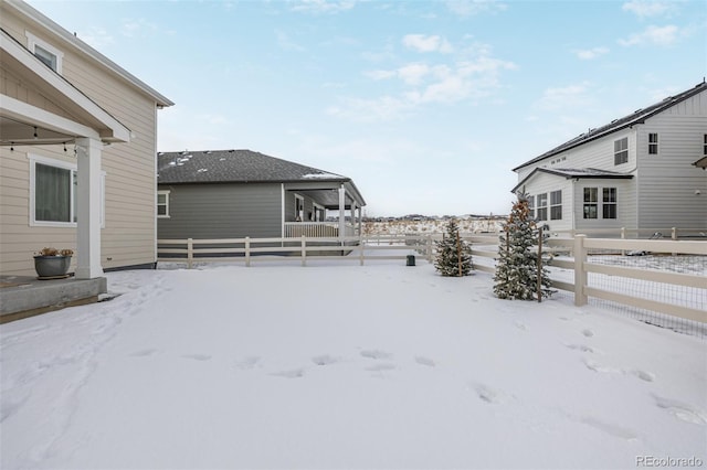 view of yard covered in snow