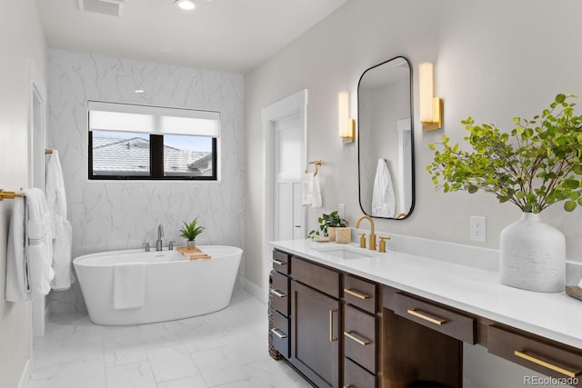 bathroom featuring recessed lighting, vanity, visible vents, marble finish floor, and a soaking tub