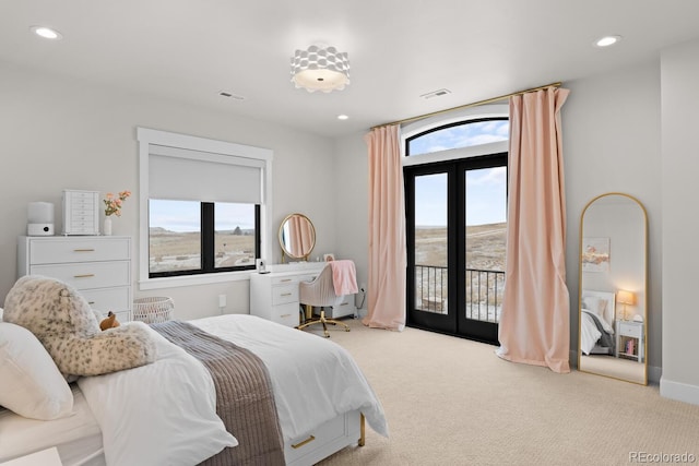 carpeted bedroom featuring baseboards, recessed lighting, visible vents, and access to exterior