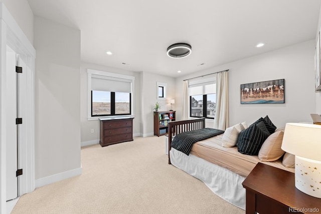 bedroom featuring light carpet, baseboards, and recessed lighting