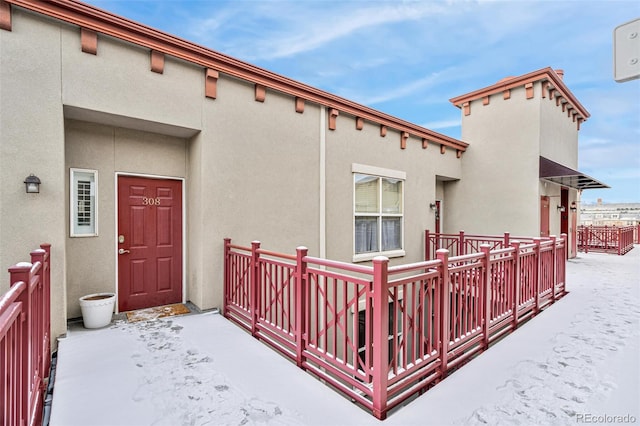 view of snow covered property entrance