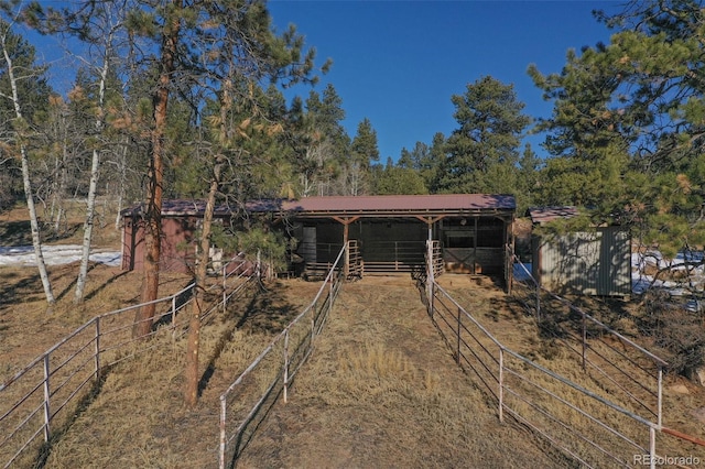 view of front facade with an outbuilding