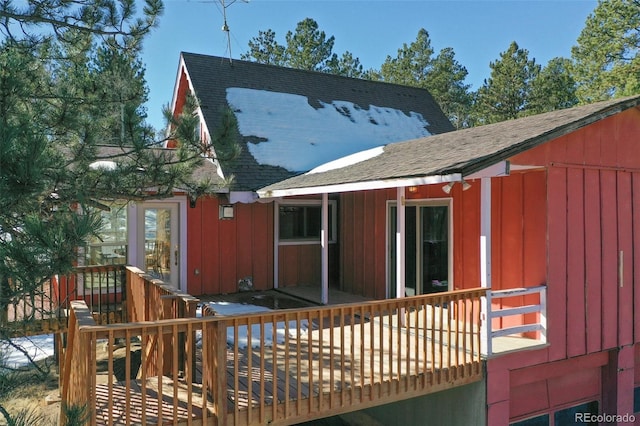 view of property exterior with a deck