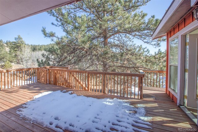 view of snow covered deck