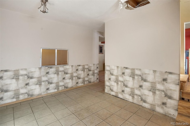 unfurnished room featuring light tile patterned floors