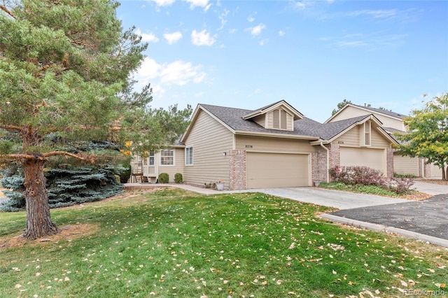 view of front facade with a garage and a front lawn