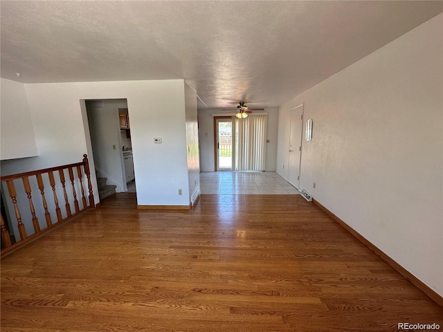 spare room with ceiling fan and hardwood / wood-style floors