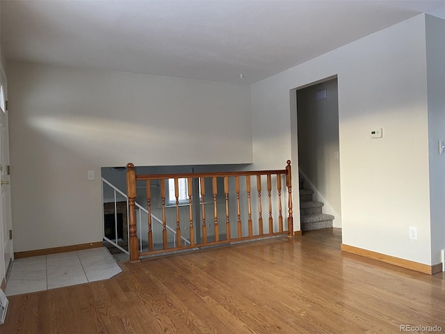 empty room with wood-type flooring