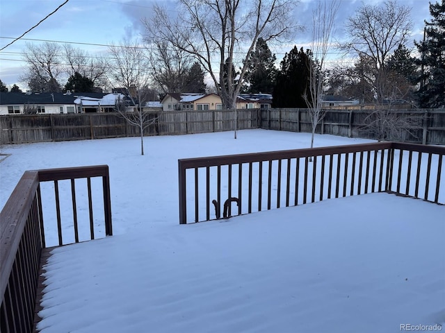 view of yard layered in snow