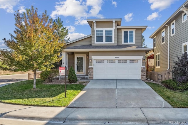 view of front of house featuring a garage and a front yard