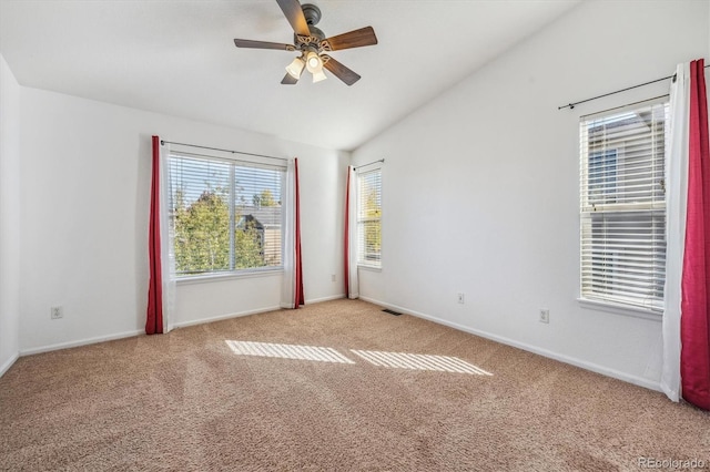 empty room featuring ceiling fan and light colored carpet