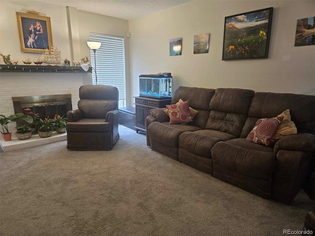 living area with a brick fireplace, carpet floors, and a textured ceiling