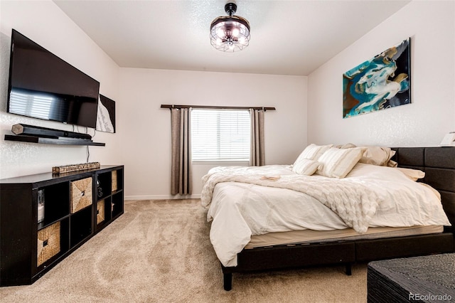 bedroom with light colored carpet