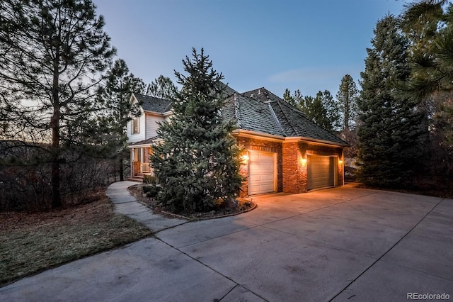 view of front of house with concrete driveway and an attached garage