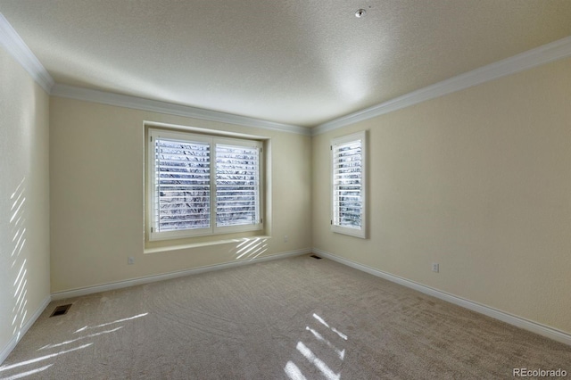 carpeted empty room featuring crown molding, visible vents, baseboards, and a textured ceiling