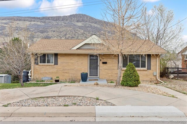 217 Ford St, Golden, CO 80403 - ranch-style house featuring brick siding and a mountain view