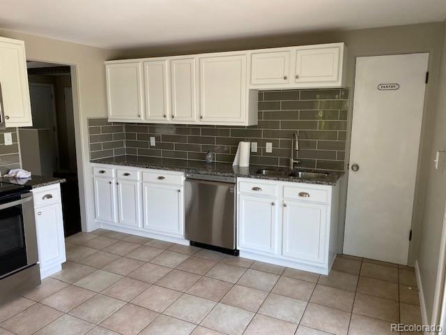 217 Ford St, Golden, CO 80403 - kitchen with appliances with stainless steel finishes, a sink, tasteful backsplash, and white cabinets