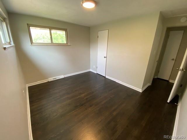 217 Ford St, Golden, CO 80403 - unfurnished room with dark wood-type flooring and baseboards