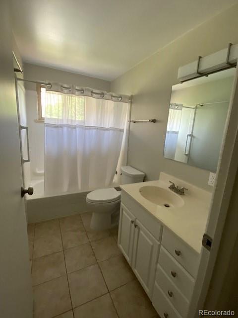 217 Ford St, Golden, CO 80403 - bathroom with shower / bath combo, vanity, tile patterned floors, and toilet