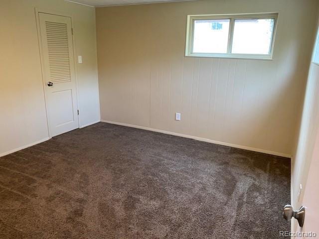 217 Ford St, Golden, CO 80403 - empty room with dark carpet and baseboards
