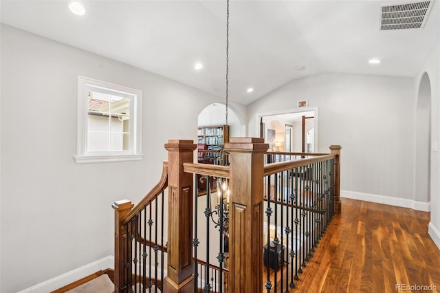 1317 S Saint Paul St, Denver, CO 80210 - stairway with arched walkways, wood finished floors, recessed lighting, baseboards, and vaulted ceiling