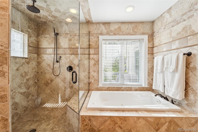 1317 S Saint Paul St, Denver, CO 80210 - full bathroom with healthy amount of natural light, a bath, tiled shower, and tile walls