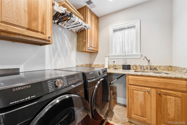 1317 S Saint Paul St, Denver, CO 80210 - washroom with washing machine and dryer and cabinet space