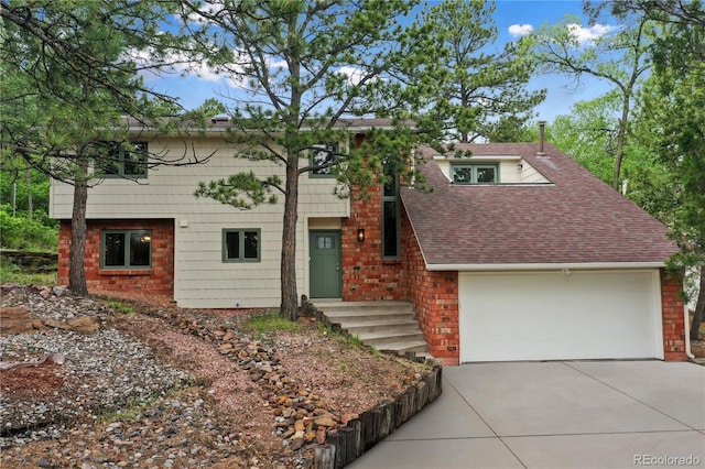 595 Wintery Cir, Colorado Springs, CO 80919 - view of front of property with concrete driveway, roof with shingles, and brick siding