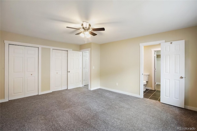 595 Wintery Cir, Colorado Springs, CO 80919 - unfurnished bedroom featuring carpet, two closets, ensuite bathroom, baseboards, and a ceiling fan