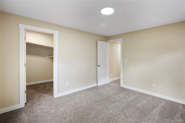 595 Wintery Cir, Colorado Springs, CO 80919 - unfurnished bedroom with carpet floors, baseboards, a spacious closet, and a closet