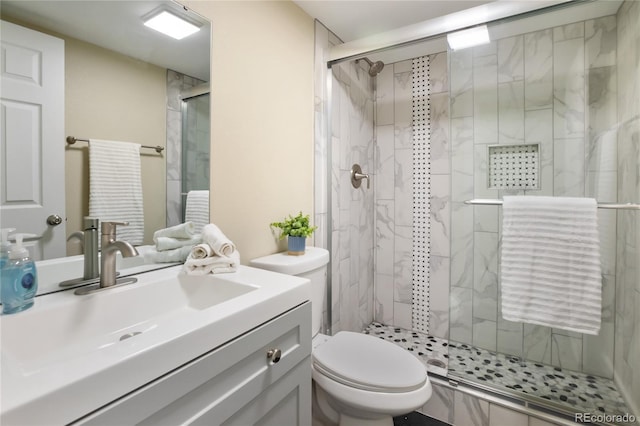 595 Wintery Cir, Colorado Springs, CO 80919 - bathroom with toilet, a shower stall, and vanity