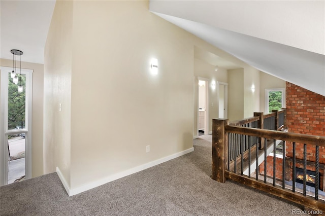 595 Wintery Cir, Colorado Springs, CO 80919 - hallway with carpet, an upstairs landing, healthy amount of natural light, and baseboards