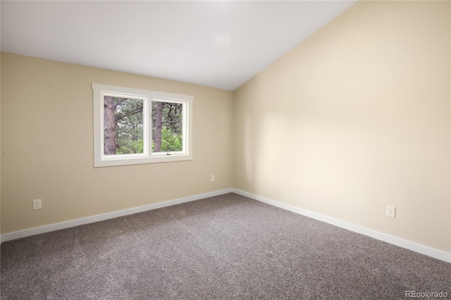 595 Wintery Cir, Colorado Springs, CO 80919 - empty room with carpet floors, baseboards, and vaulted ceiling
