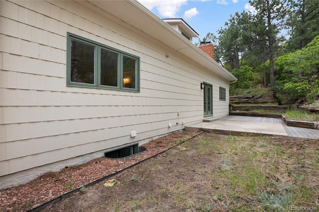 595 Wintery Cir, Colorado Springs, CO 80919 - rear view of property featuring a patio area and a chimney