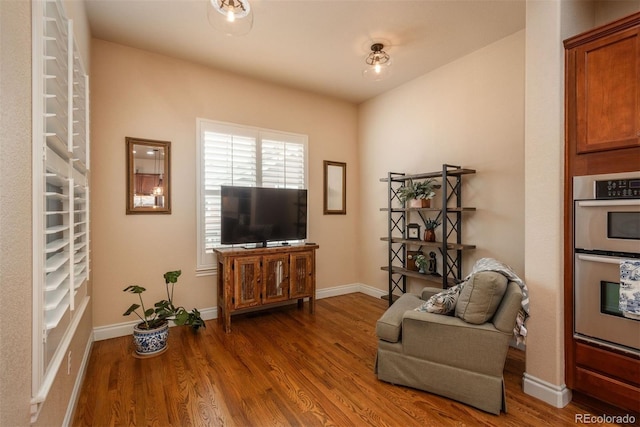 9165 Kornbrust Dr, Lone Tree, CO 80124 - sitting room featuring wood finished floors and baseboards