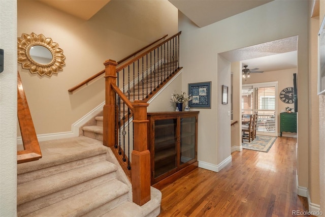 9165 Kornbrust Dr, Lone Tree, CO 80124 - staircase with wood finished floors, baseboards, and ceiling fan