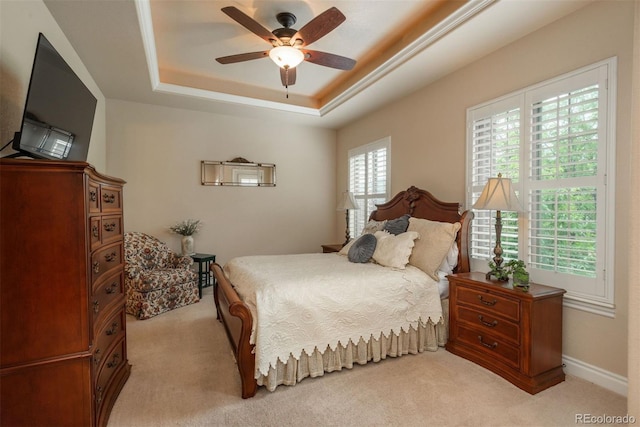 9165 Kornbrust Dr, Lone Tree, CO 80124 - bedroom with light carpet, a raised ceiling, and ceiling fan