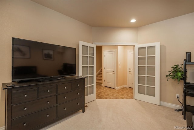 9165 Kornbrust Dr, Lone Tree, CO 80124 - bedroom with french doors, light colored carpet, baseboards, and recessed lighting