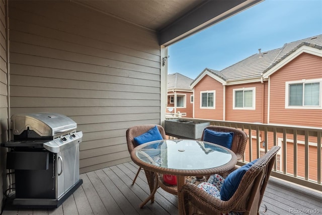 9165 Kornbrust Dr, Lone Tree, CO 80124 - wooden terrace with outdoor dining space and a grill