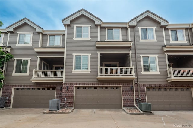 9165 Kornbrust Dr, Lone Tree, CO 80124 - view of front of house featuring a garage, brick siding, and central AC