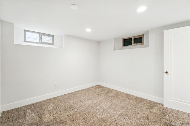 below grade area featuring carpet, baseboards, and recessed lighting