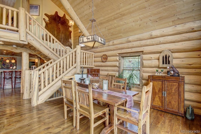 1198 Kootchie Kootchie Rd, Alma, CO 80420 - dining area featuring hardwood / wood-style floors, beamed ceiling, rustic walls, high vaulted ceiling, and wooden ceiling