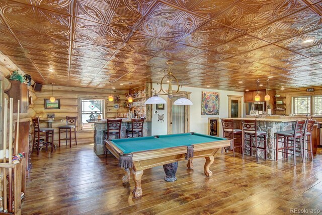 1198 Kootchie Kootchie Rd, Alma, CO 80420 - game room featuring bar area, billiards, log walls, and hardwood / wood-style floors