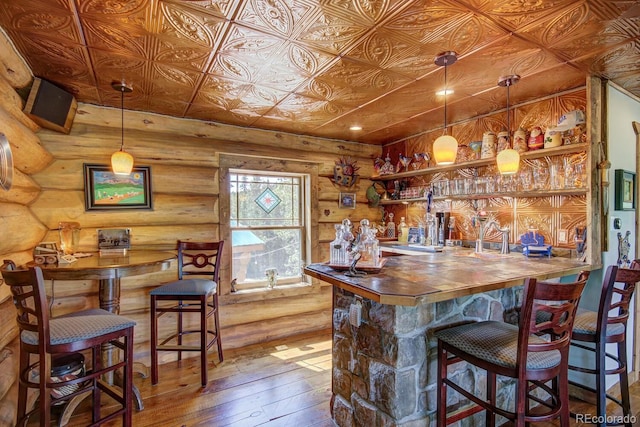 1198 Kootchie Kootchie Rd, Alma, CO 80420 - bar featuring hardwood / wood-style floors and rustic walls