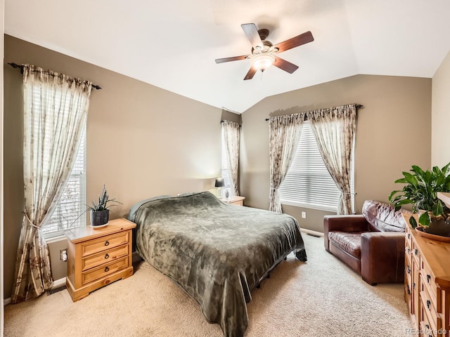 bedroom featuring ceiling fan, carpet floors, and vaulted ceiling