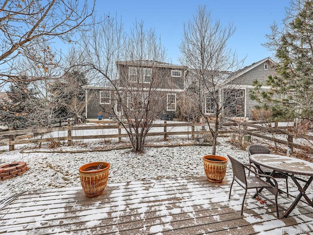 view of snow covered deck