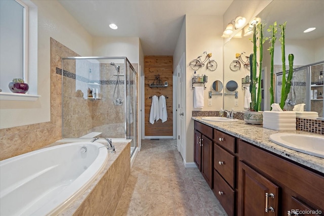 bathroom with vanity and plus walk in shower